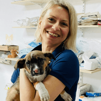 Woman holding dog